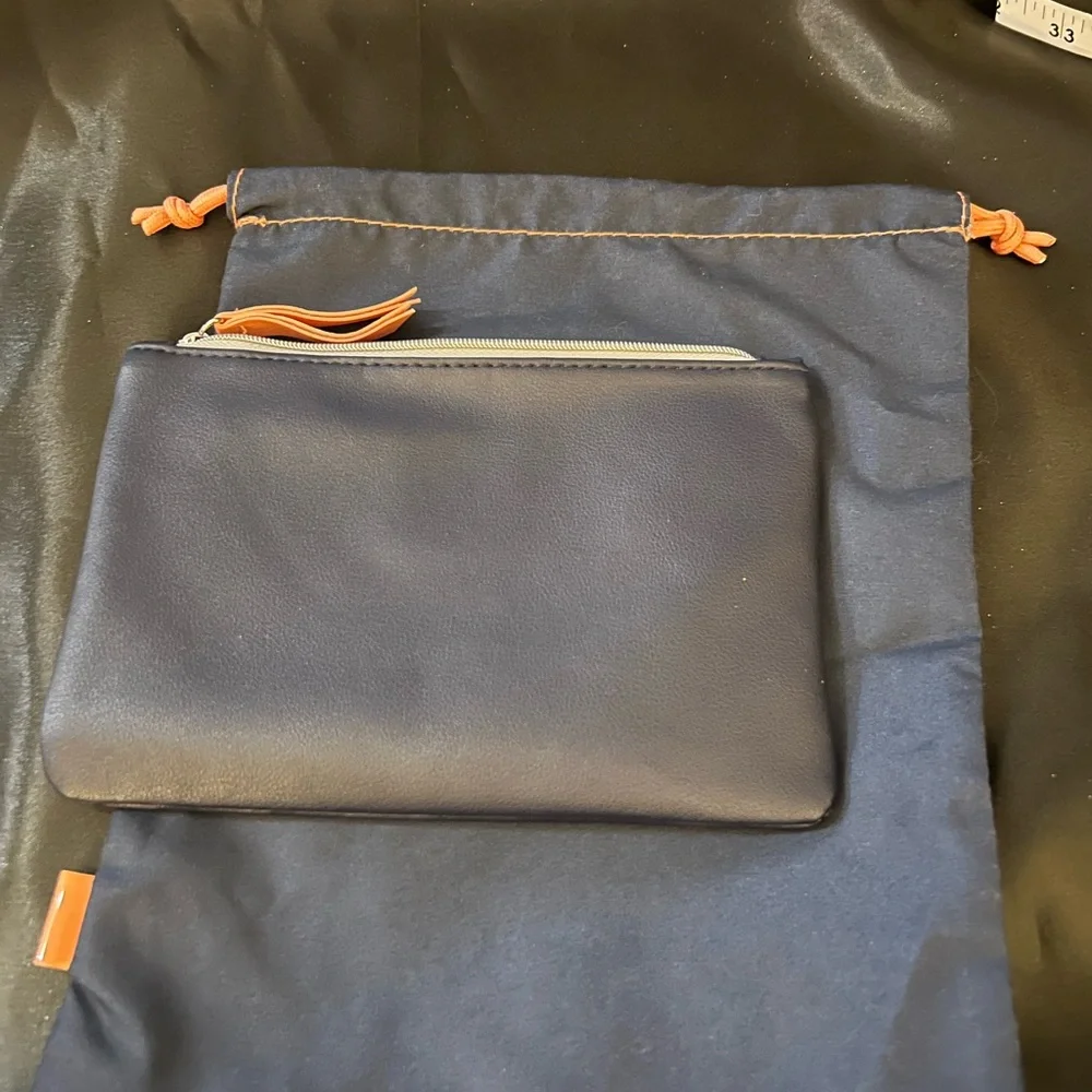 2 Ipsy bags, never used. One is a drawstring cloth bag and the other zips.